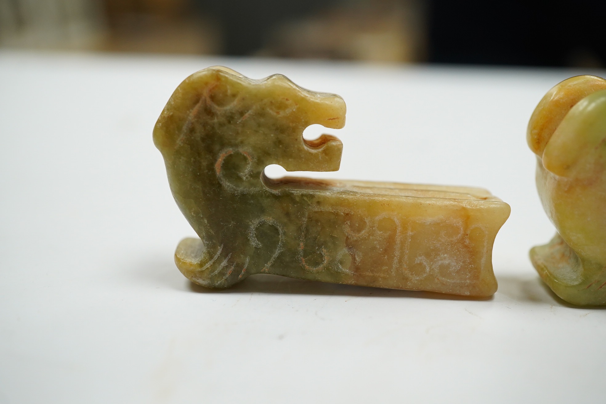 Two Chinese jade carvings in the form of animals, both 5cm high. Condition - good